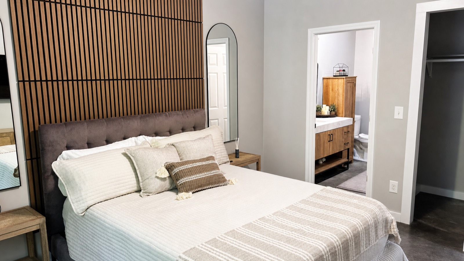 Queen primary bedroom with slat accent wall