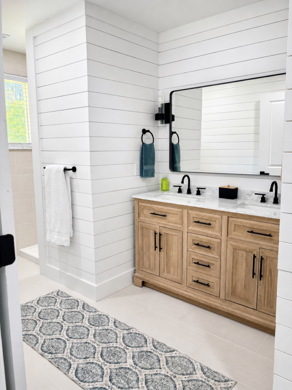 Double-vanity bathroom with shiplap walls
