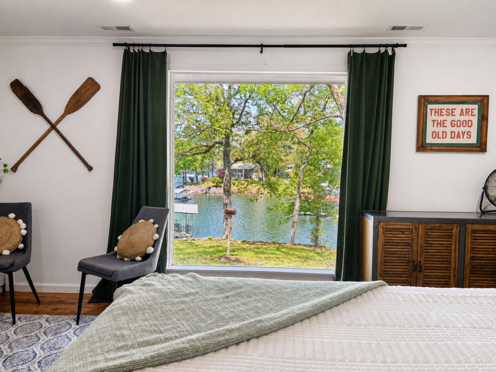 Bedroom with a picture window over the lake