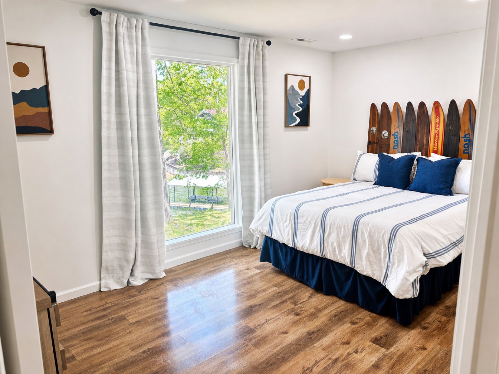 Bedroom with vintage waterski headboard